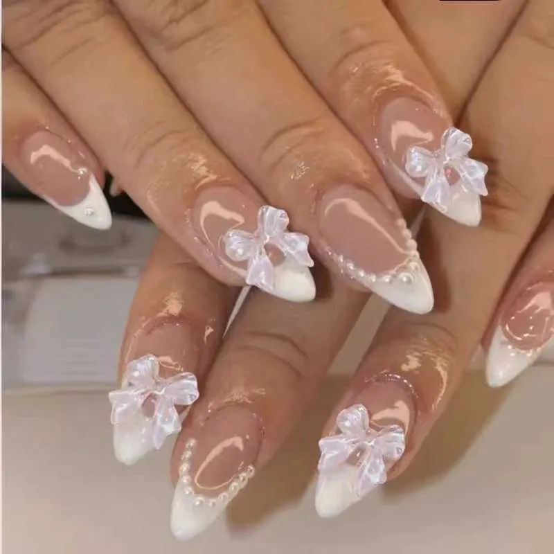 White Bows And Pearls On Accent Nails Visual Idea White Bows And Pearls On Accent Nails Visual Idea β New Years French Tip Nails 2027