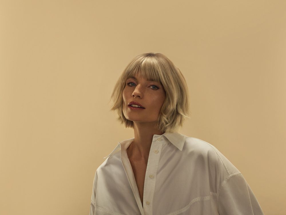 Blunt Lob With Inward Curl and Blunt Bangs — Winter Haircuts for Straight Hair