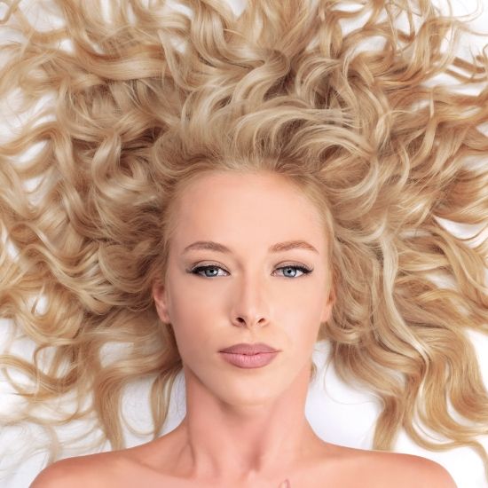 Extreme Length Platinum Blonde Waves — Winter Hair Colors for Pale Skin
