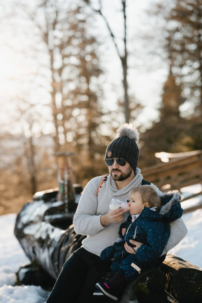 Cozy Sweaters and Snowsuit for a Father-Child Winter Photo — Winter Family Photo Outfits