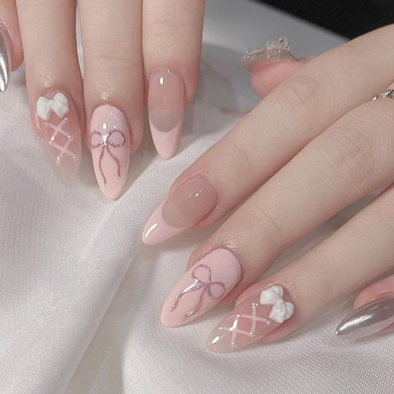 3D White Bows on Light Pink Almonds 3D White Bows on Light Pink Almonds β Winter Bow Nails