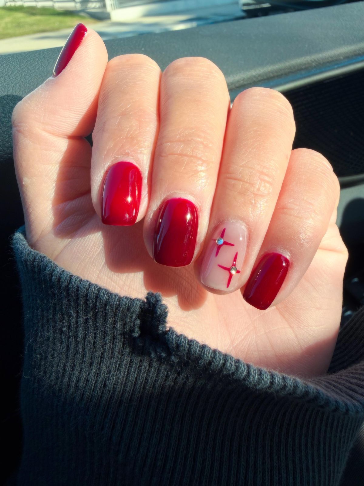 Deep Red with Star and Rhinestone Accents Deep Red with Star and Rhinestone Accents β Short Christmas Nails 2026