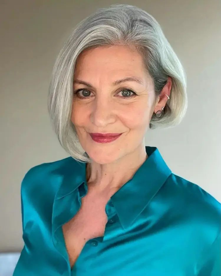 Sleek Ash Blonde Asymmetrical Bob — Winter Hair Colors for Women Over 60