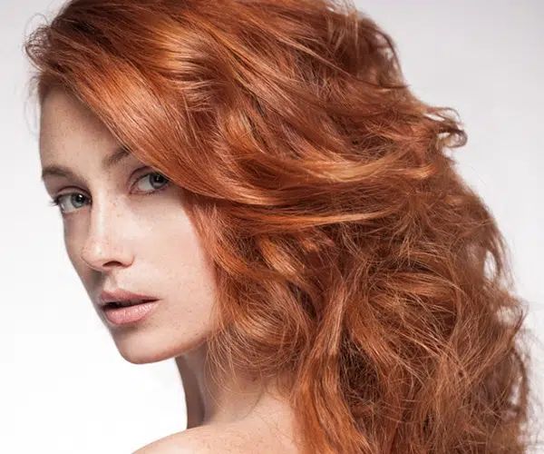 Intense Copper Red Mid-Back Waves — Winter Hair Colors for Pale Skin
