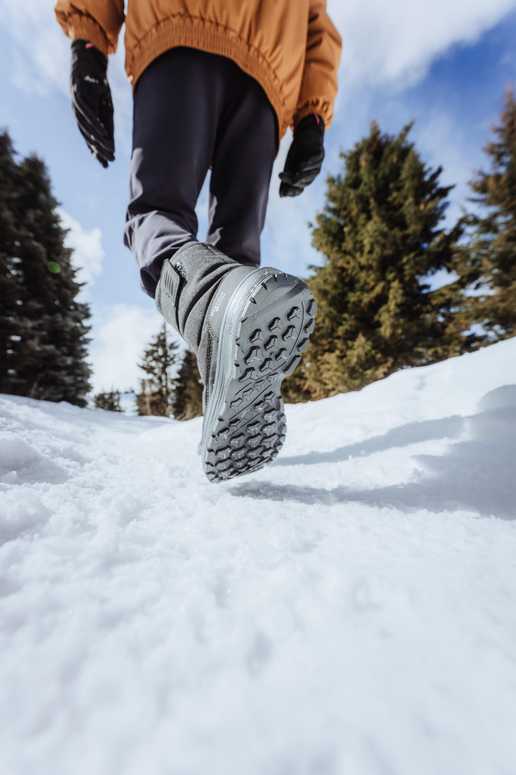 Grey Snow Boots with Orange Jacket and Snowy Backdrop Grey Snow Boots with Orange Jacket and Snowy Backdrop β Snow Boots Outfits
