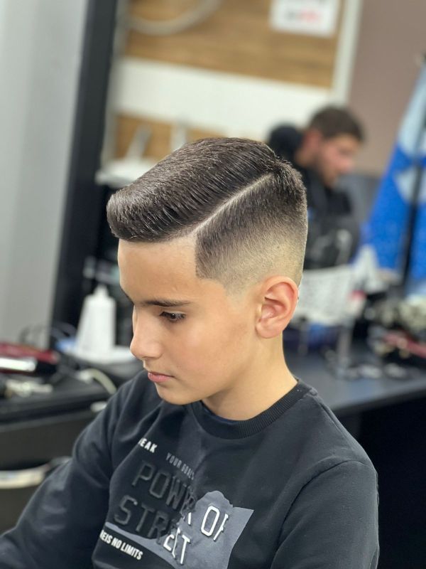 Fade With Voluminous Hard Part Fade With Voluminous Hard Part β Winter Haircuts for Boys
