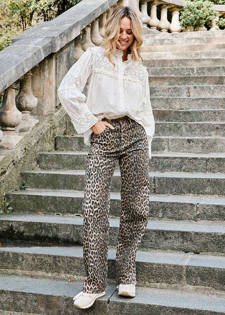Bold Leopard Trousers Paired with Eyelet Blouse for Casual Chic — Winter Outfits for Warm Weather