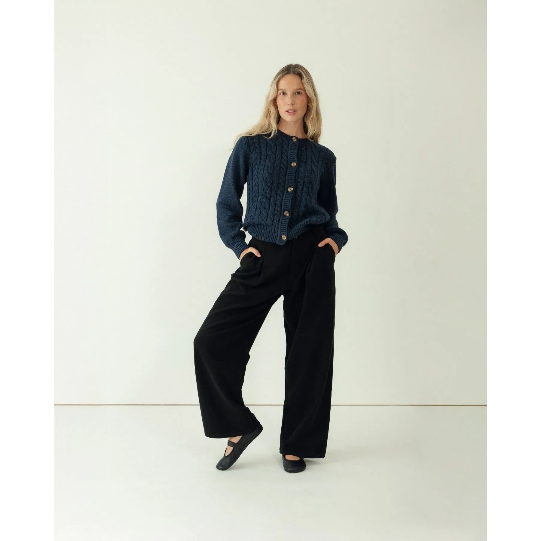 Navy Cardigan Over Black Top and Wide-Leg Pants — All Black Winter Outfits