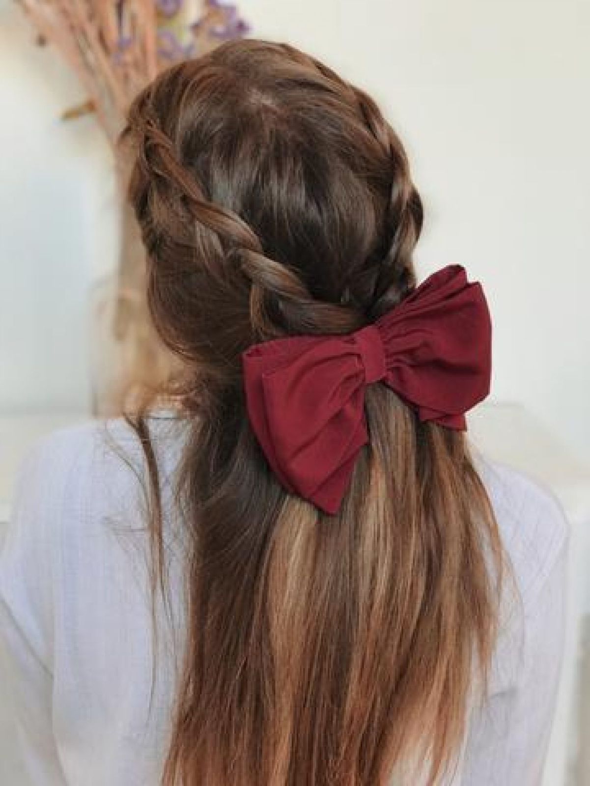 Side Braids With Burgundy Bow — Winter Date Night Hairstyles