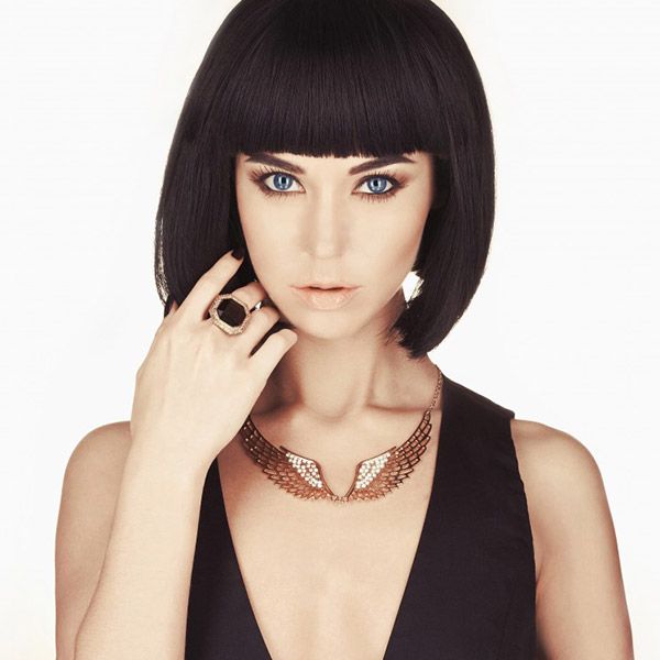 Chin-Length Sleek Dark Brown Bob With Blunt Bangs — Winter Haircuts for Round Faces