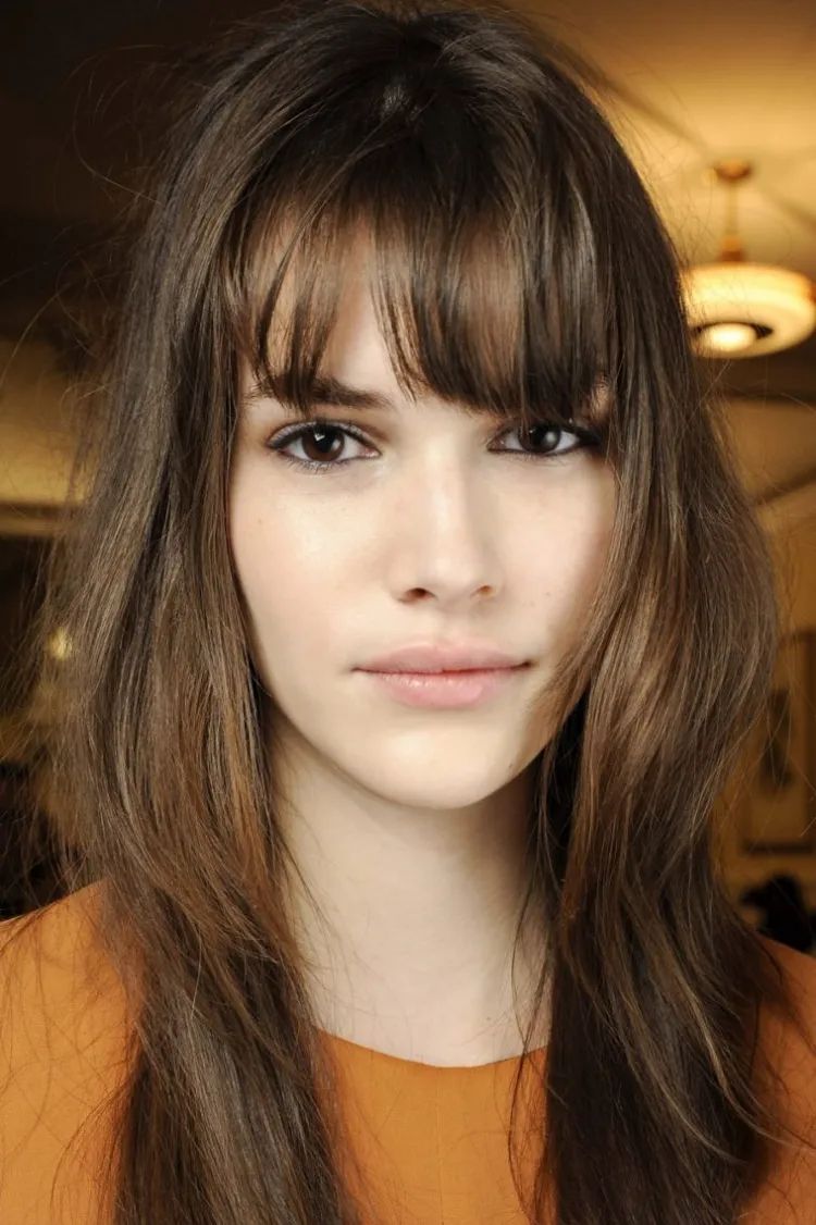 Shoulder Layers With Full Bangs — Winter Haircuts for Oval Faces