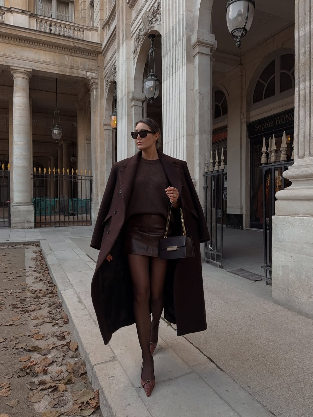 Brown Leather Mini Skirt with Crewneck Sweater and Oversized Coat — Winter Skirt Outfits