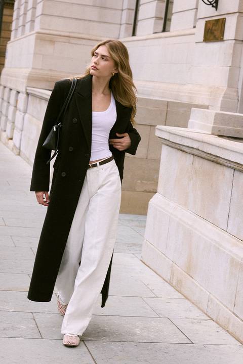 Long Black Double-Breasted Wool Coat with White Jeans — Wool Coat Outfits