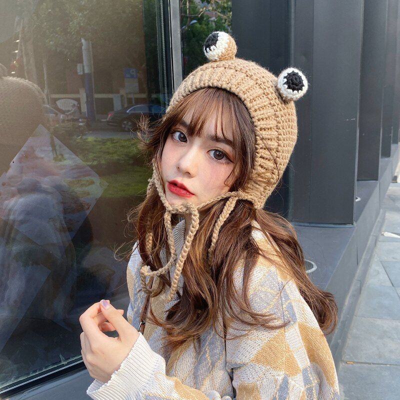 Blunt Bangs Under a Pom-Pom Beanie Blunt Bangs Under a Pom-Pom Beanie β Winter Hat Hairstyles