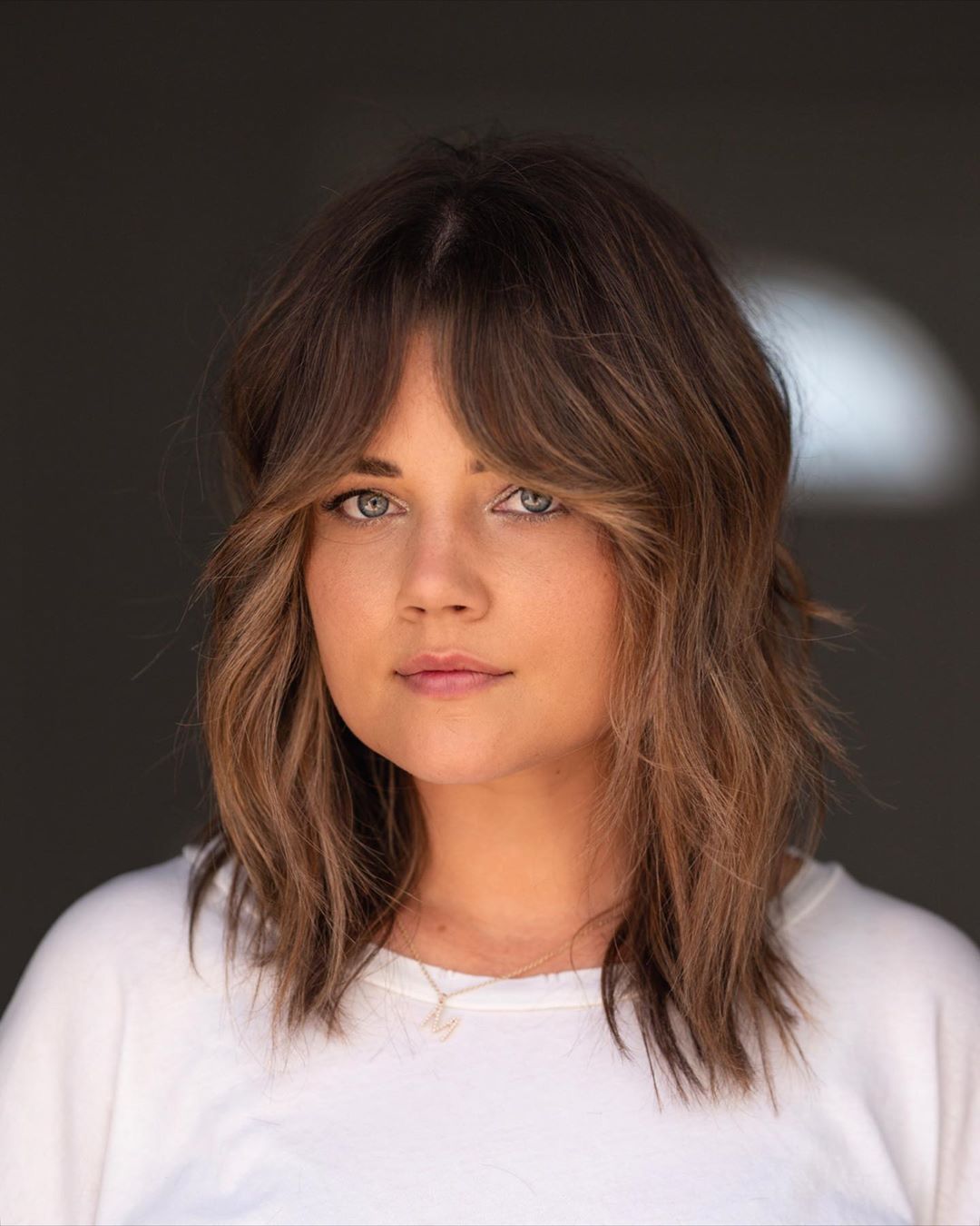 Mid-Back Layers With Dark Blonde Highlights Mid-Back Layers With Dark Blonde Highlights β Winter Hairstyles with Bangs