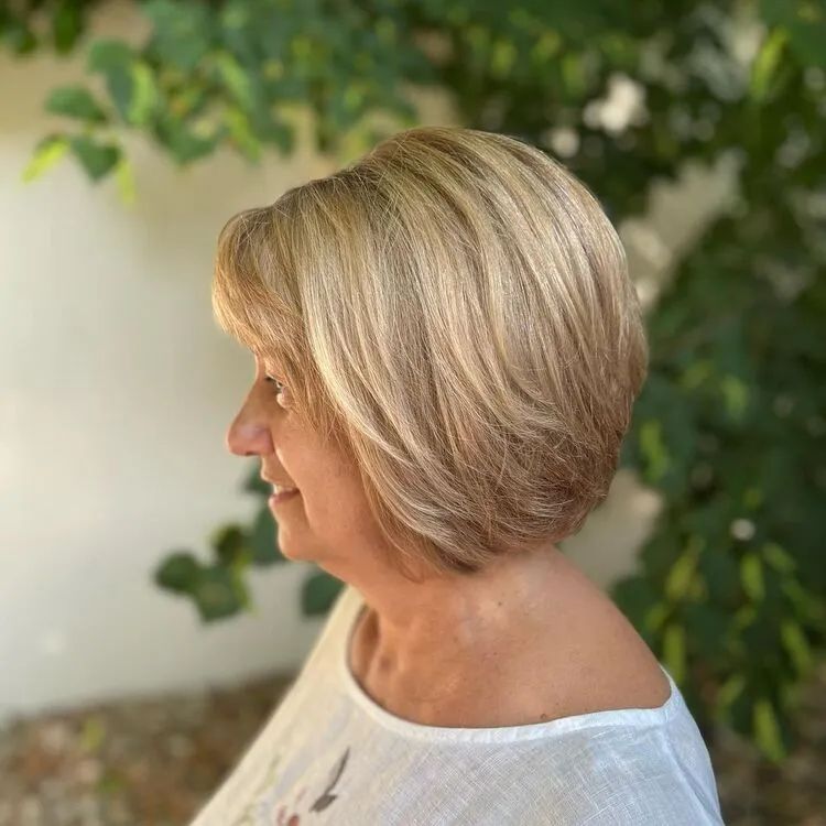 Chin-Length Bob With Side-Swept Fringe Chin-Length Bob With Side-Swept Fringe β Winter Haircuts for Women Over 70