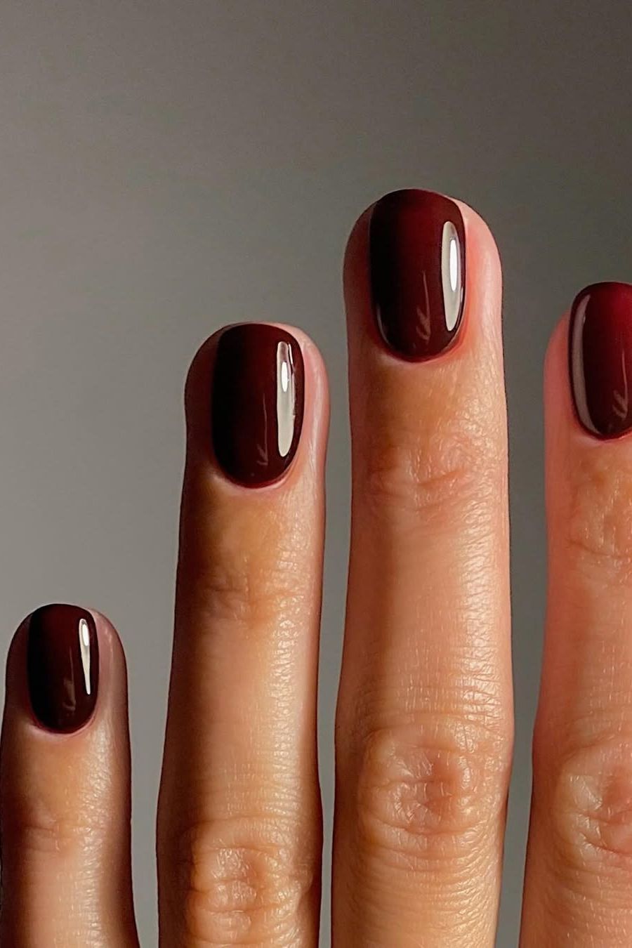 None Deep Burgundy Glossy Oval Nails None Deep Burgundy Glossy Oval Nails β Winter Nail Colors for Dark Skin