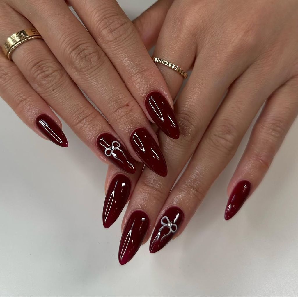 Deep Red Glossy with Silver Bows Deep Red Glossy with Silver Bows β New Years Nail Colors 2027