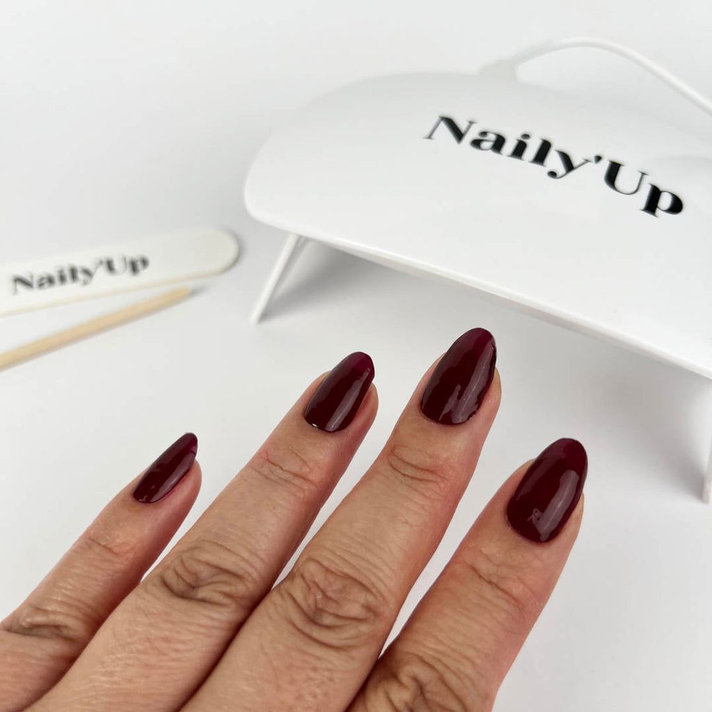 Uniformly Shaped Opaque Burgundy Nails Uniformly Shaped Opaque Burgundy Nails