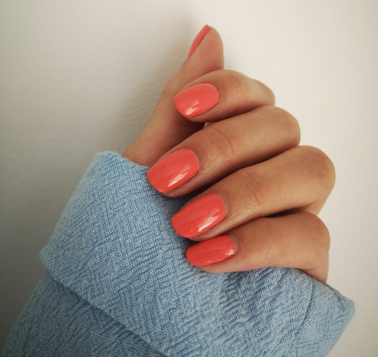 Glossy Medium Oval Coral Orange Nails — Holiday Nail Colors 2026