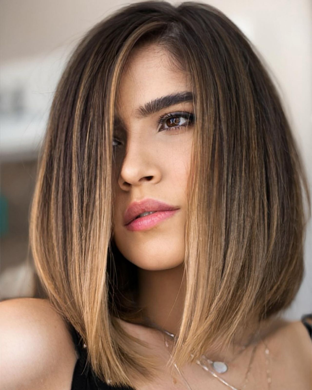 Dark Brown Chin Bob With Highlights — Winter Haircuts for Oval Faces