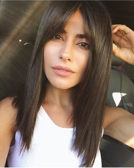 Mid-Back Layers With Prominent Curtain Bangs — Winter Haircuts for Straight Hair