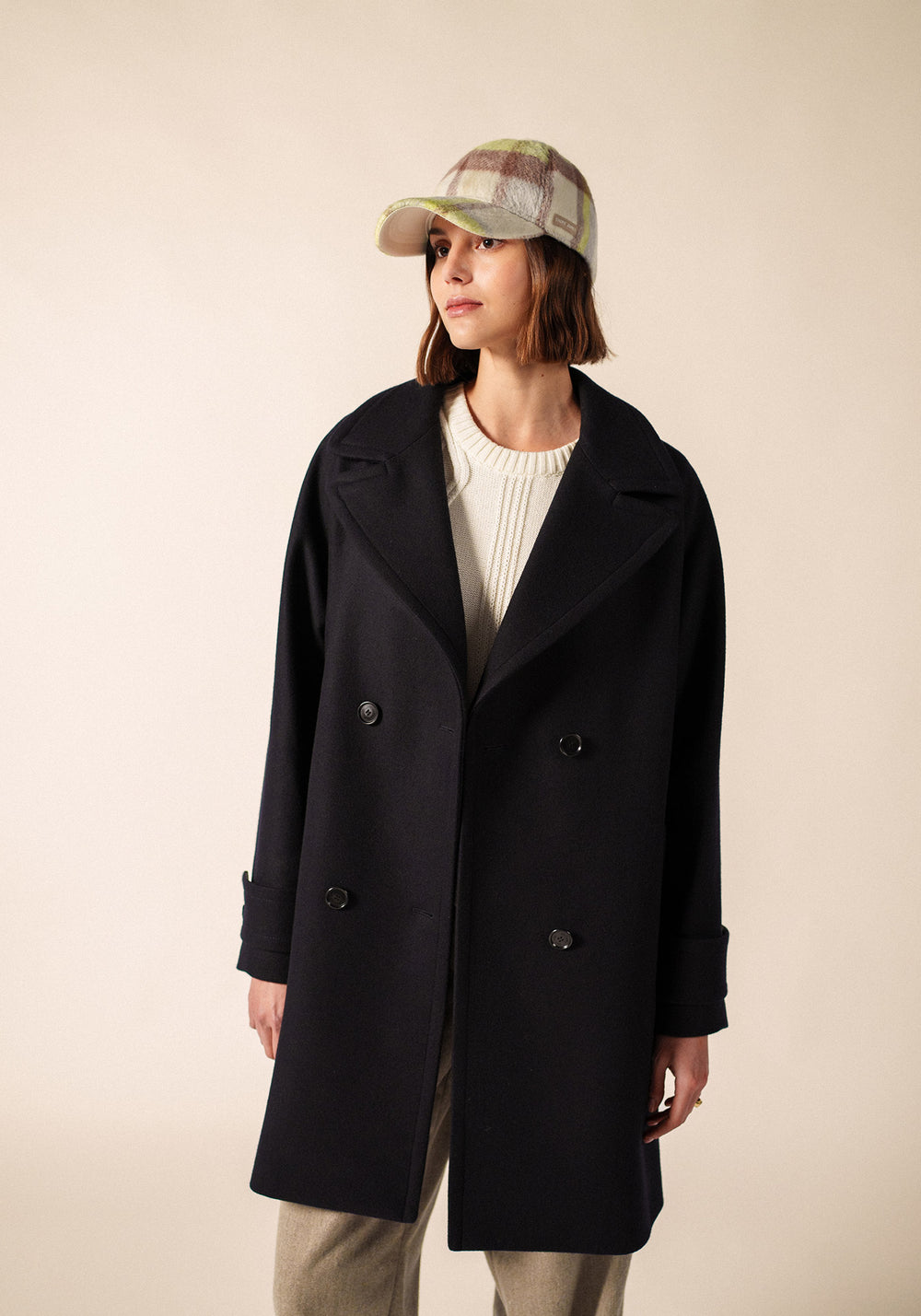 Navy Peacoat with Cream Knit and Beige Trousers — Europe Winter Outfits