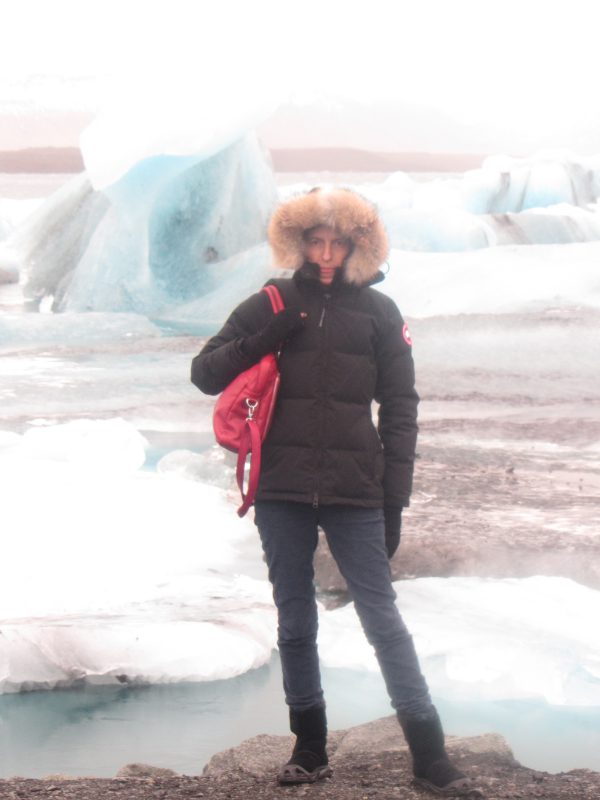 Black Puffer Jacket with Red Backpack Accent — Snow Day Outfits