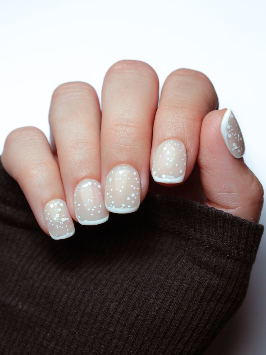 Milky Base with Scattered Snowflakes Milky Base with Scattered Snowflakes β Winter White Nails