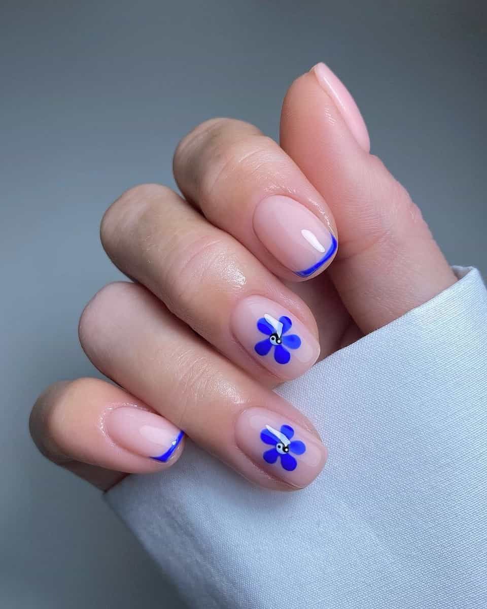 Short Oval Blue Flower and French Tip Short Oval Blue Flower and French Tip β Winter to Spring Transition Nails