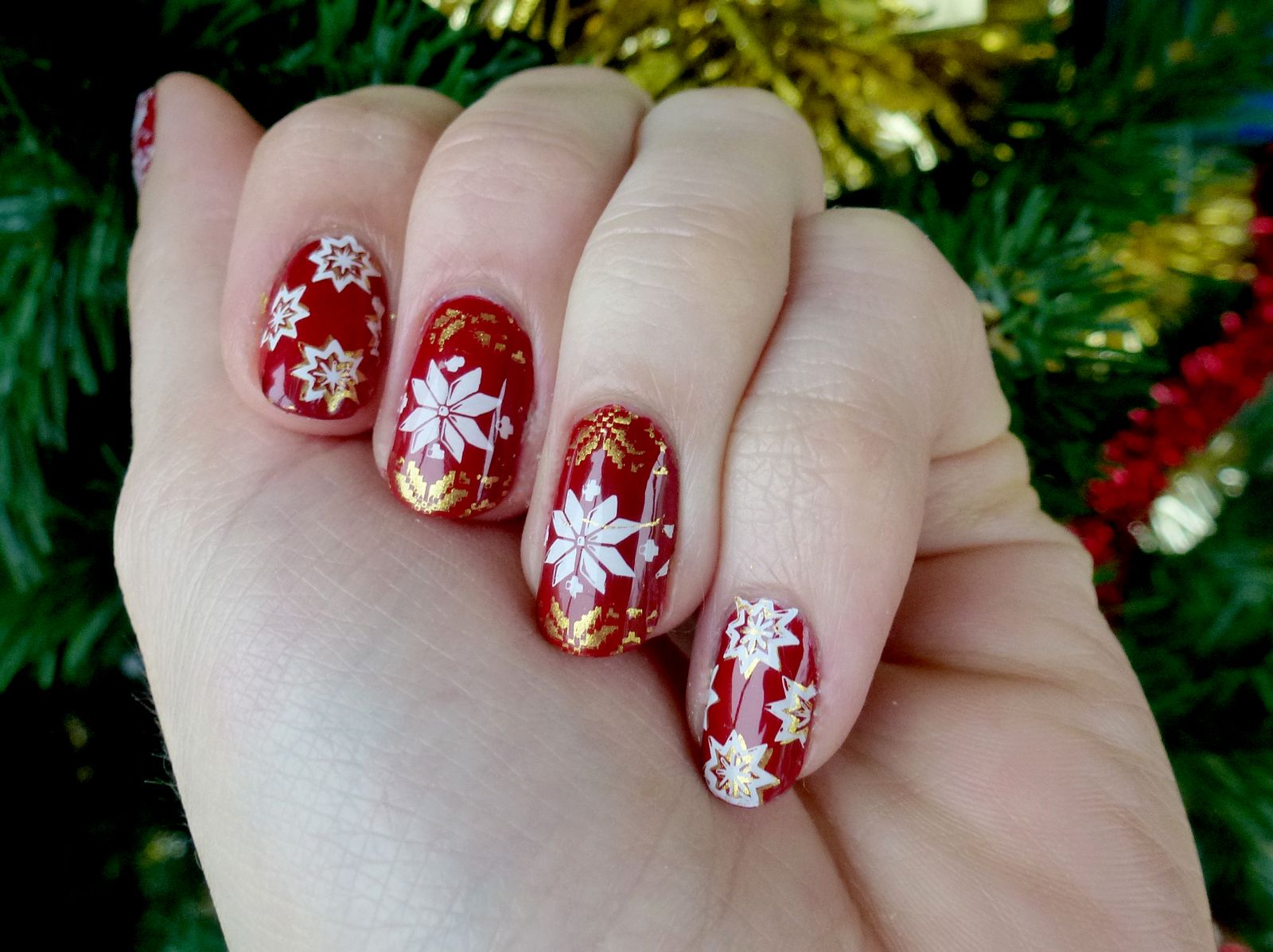 Glossy Red Nails with Gold Snowflake Accents Glossy Red Nails with Gold Snowflake Accents β Red Christmas Nails 2026