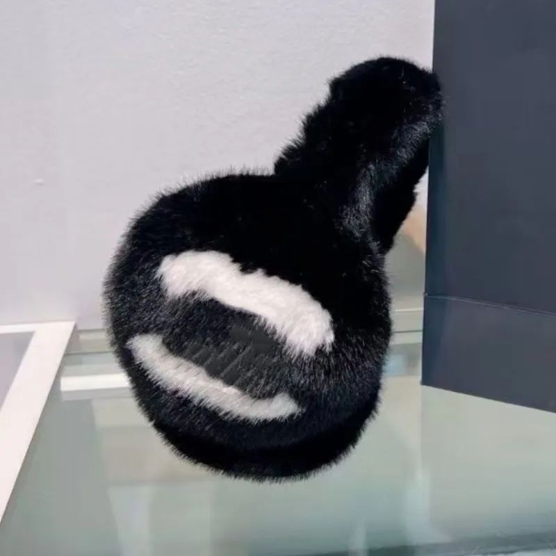 Textured Black and White Furry Earmuffs with Logo Detail — Earmuffs Outfits