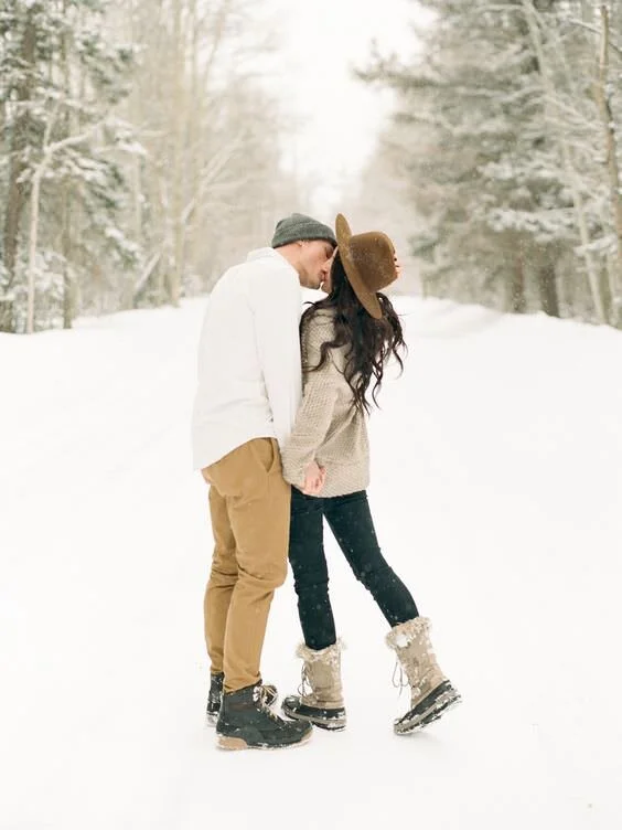 Winter Hats and Fur-Lined Boots for a Snowy Couple Photo — Winter Family Photo Outfits