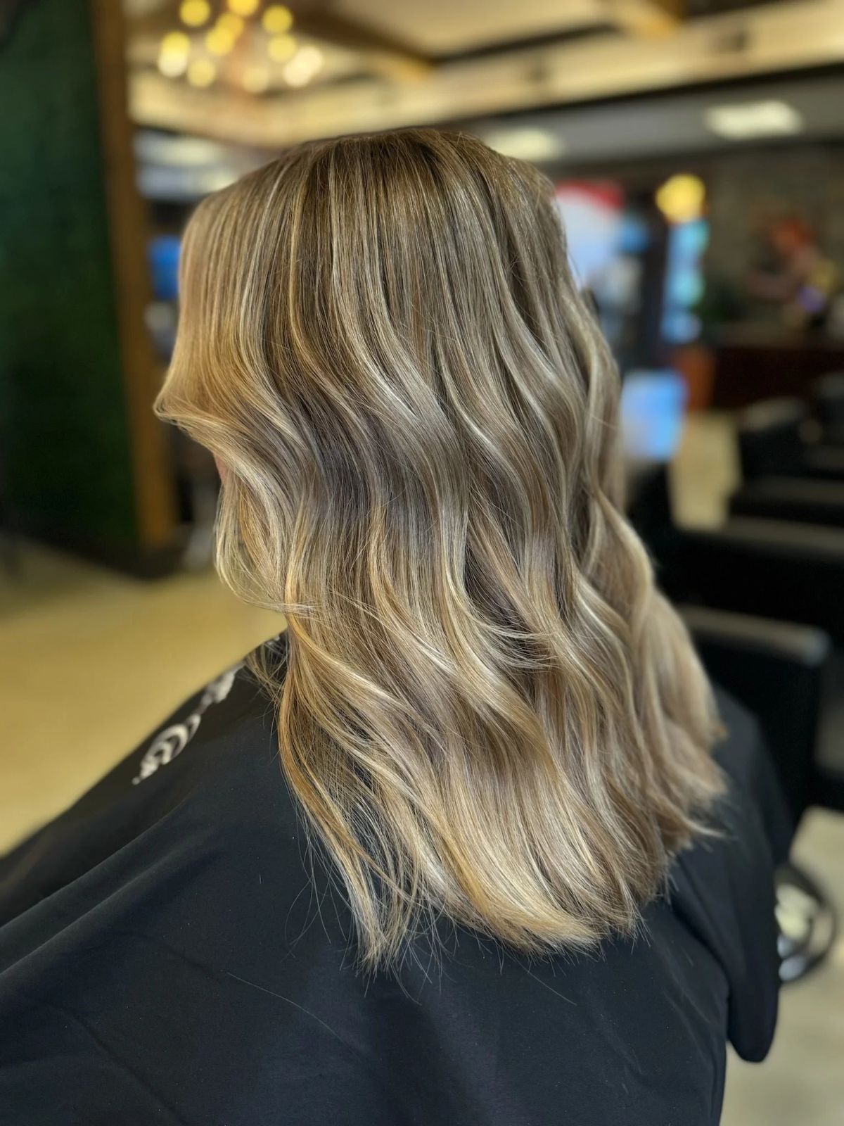 Thick Wavy Blonde With Lighter Blonde Highlights — Reverse Balayage