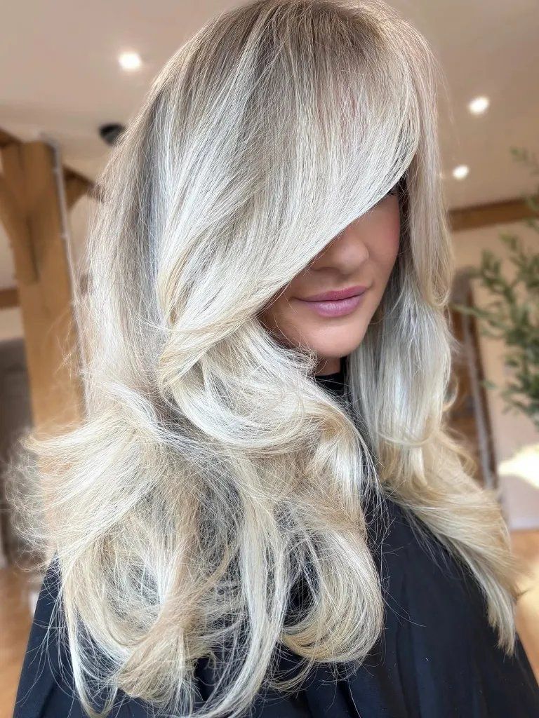 Ash Blonde With Volume And Bangs — Winter Hair Colors for Blue Eyes