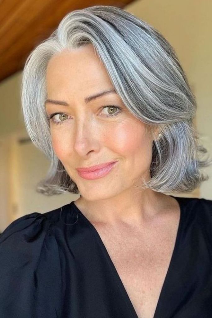 Chin Bob With Smooth Side-Swept Bangs — Winter Hairstyles for Gray Hair