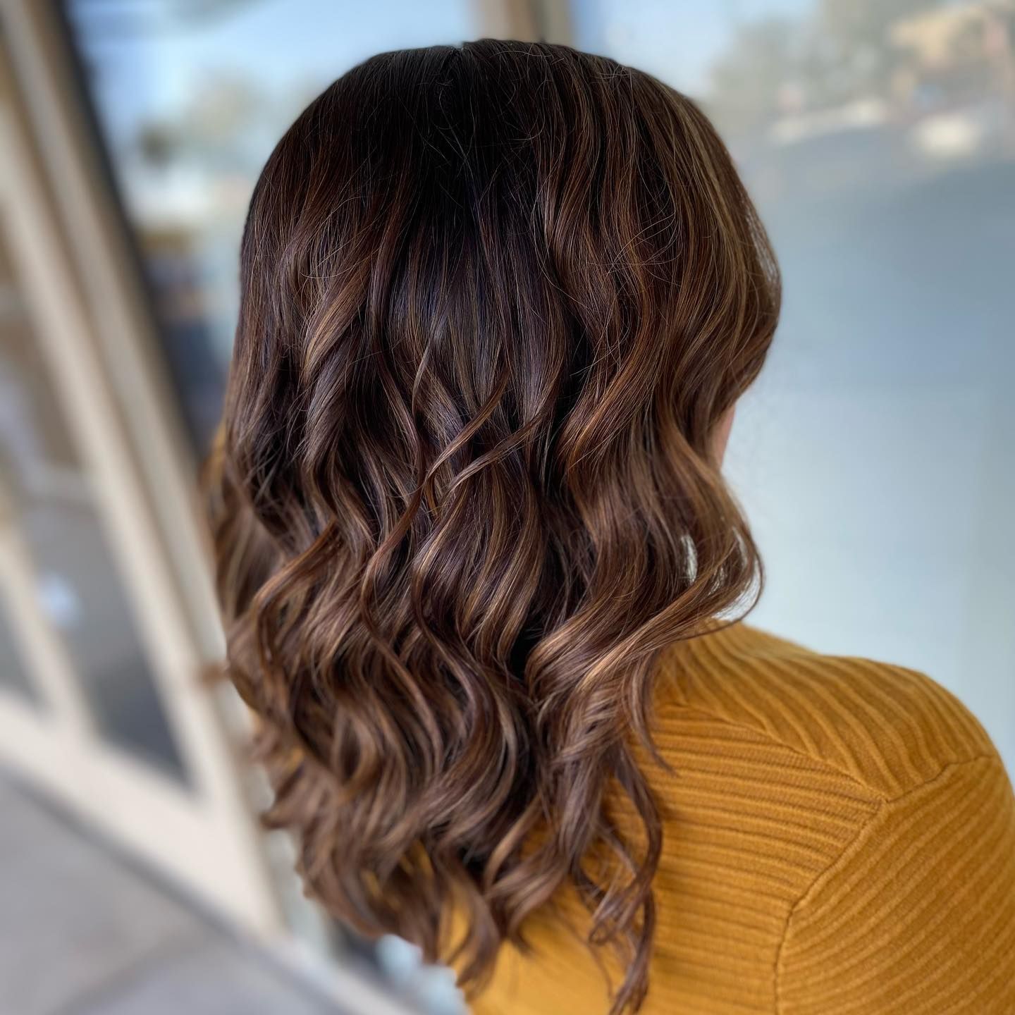 Wavy Mid-Back With Dimensional Color Wavy Mid-Back With Dimensional Color β Winter Haircuts for Heart Shaped Faces