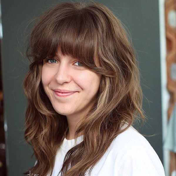Collarbone Wavy Blowout With Curtain Bangs — Winter Haircuts for Long Faces