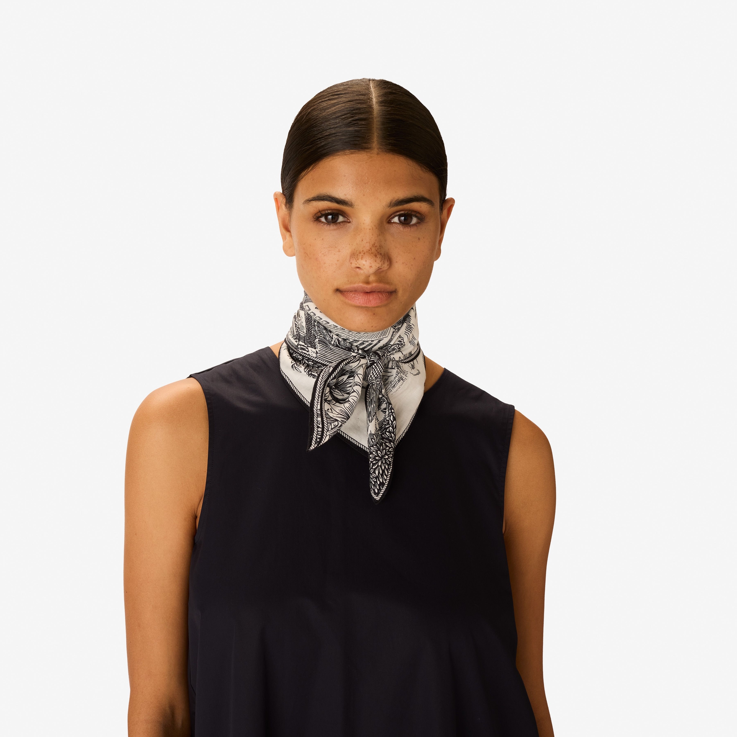 Monochromatic Scarf as a Neck Accent on a Black Top Monochromatic Scarf as a Neck Accent on a Black Top β Scarf Outfits