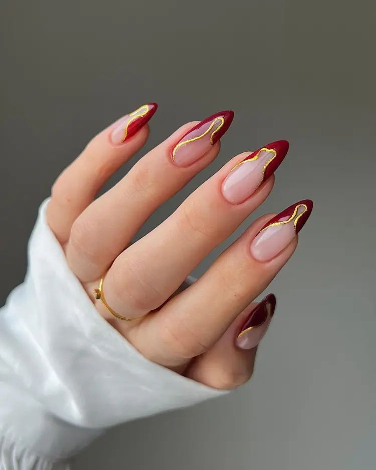 Nude Deep Red Gold Foil Almond Nails Nude Deep Red Gold Foil Almond Nails β Holiday Party Nails 2026