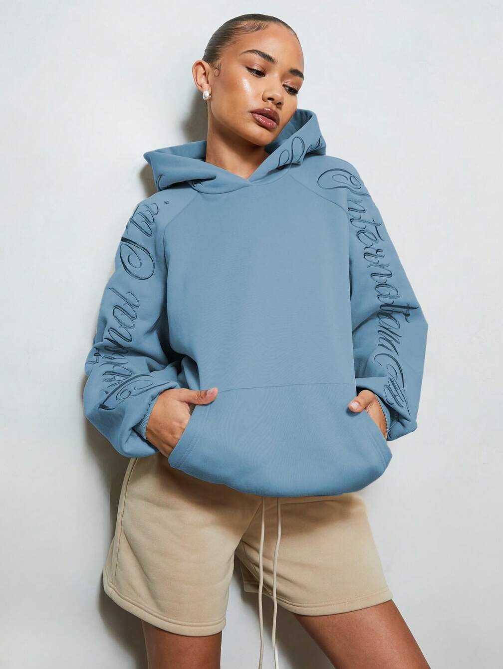 Blue Hoodie with Embossed Sleeves and Drawstring Shorts Blue Hoodie with Embossed Sleeves and Drawstring Shorts β Winter Athleisure Outfits