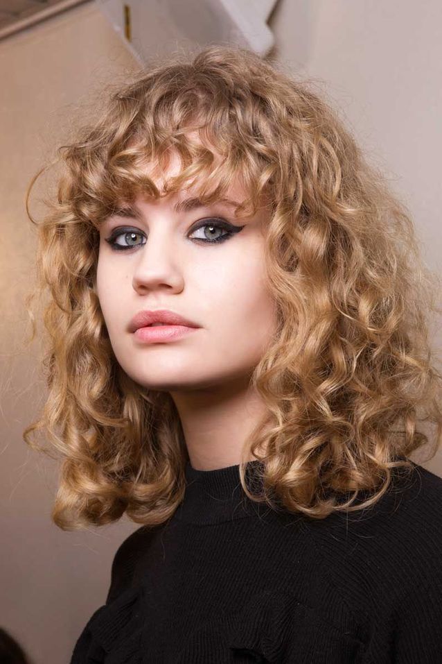 Rich Auburn Blowout With Curtain Bangs — Winter Hair Colors for Curly Hair