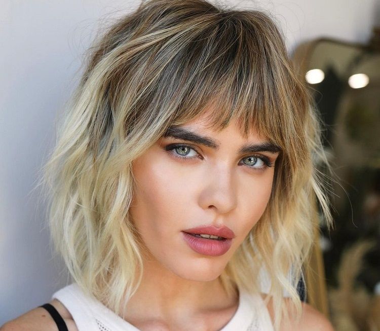 Textured Collarbone Bob With Blunt Bangs — Winter Haircuts for Oval Faces
