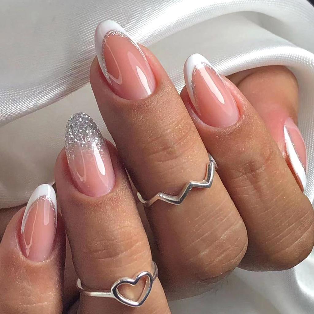 Nude Pink French with Silver Glitter Accent Nude Pink French with Silver Glitter Accent โ Short Winter Almond Nails