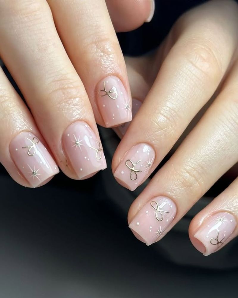 Small Gold Bows And Scattered White Dots Visual Idea Small Gold Bows And Scattered White Dots Visual Idea β Winter Bow Nails
