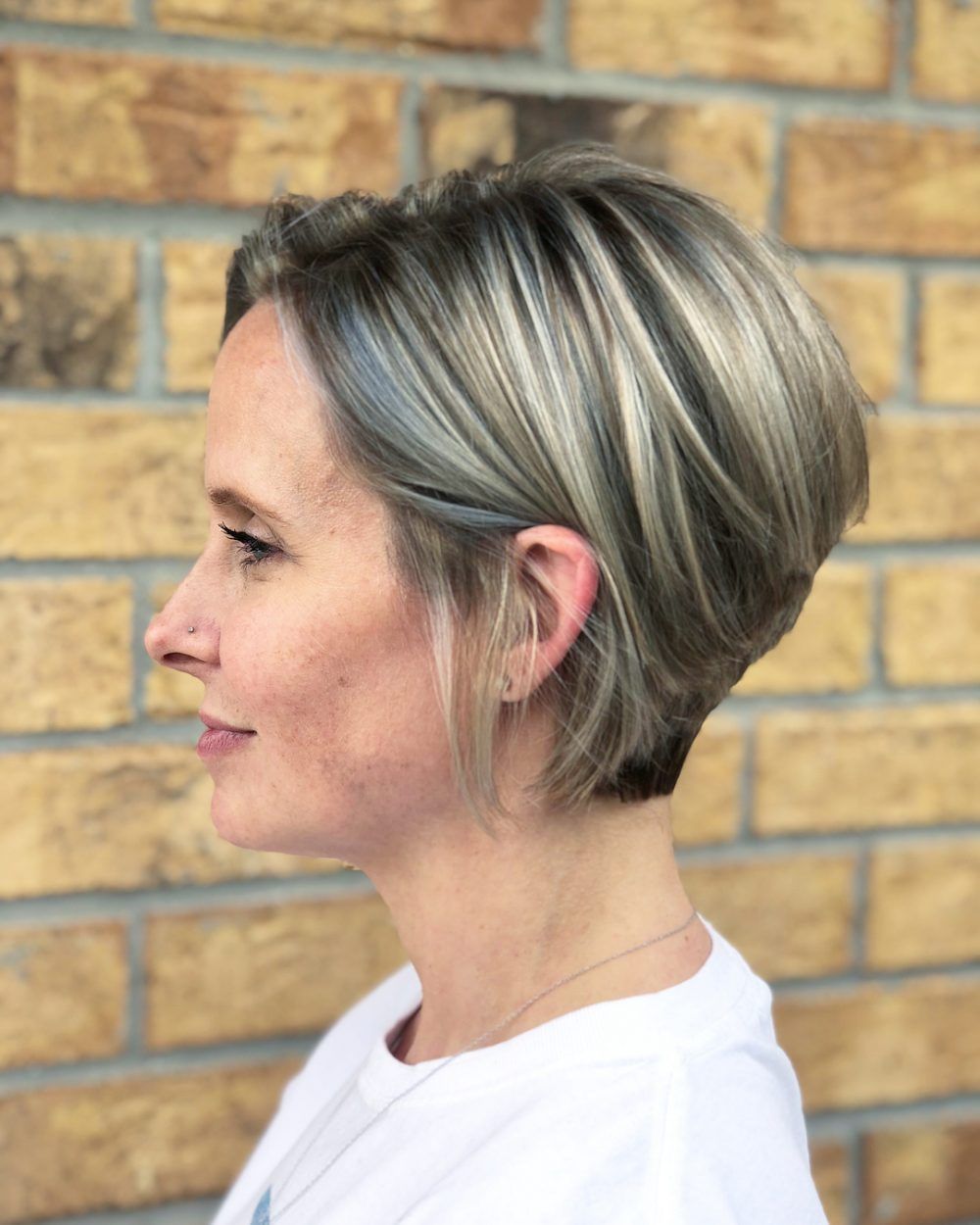 Sleek Inverted Bob Ash Blonde Grey Sleek Inverted Bob Ash Blonde Grey β Winter Hair Colors for Women Over 40