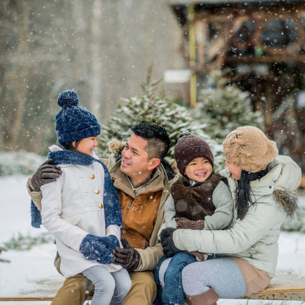 Layered Puffer Jackets and Knitwear for a Cozy Family Photo — Winter Family Photo Outfits
