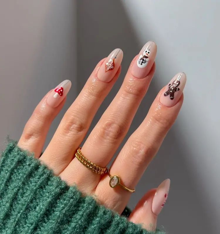 Mixed Christmas Motifs Nude Base Medium Almond Mixed Christmas Motifs Nude Base Medium Almond β Christmas Nails for Work 2026