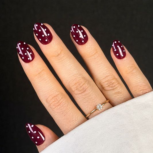 White Polka Dots On A Deep Burgundy Base Visual Idea White Polka Dots On A Deep Burgundy Base Visual Idea โ Winter Almond Nails