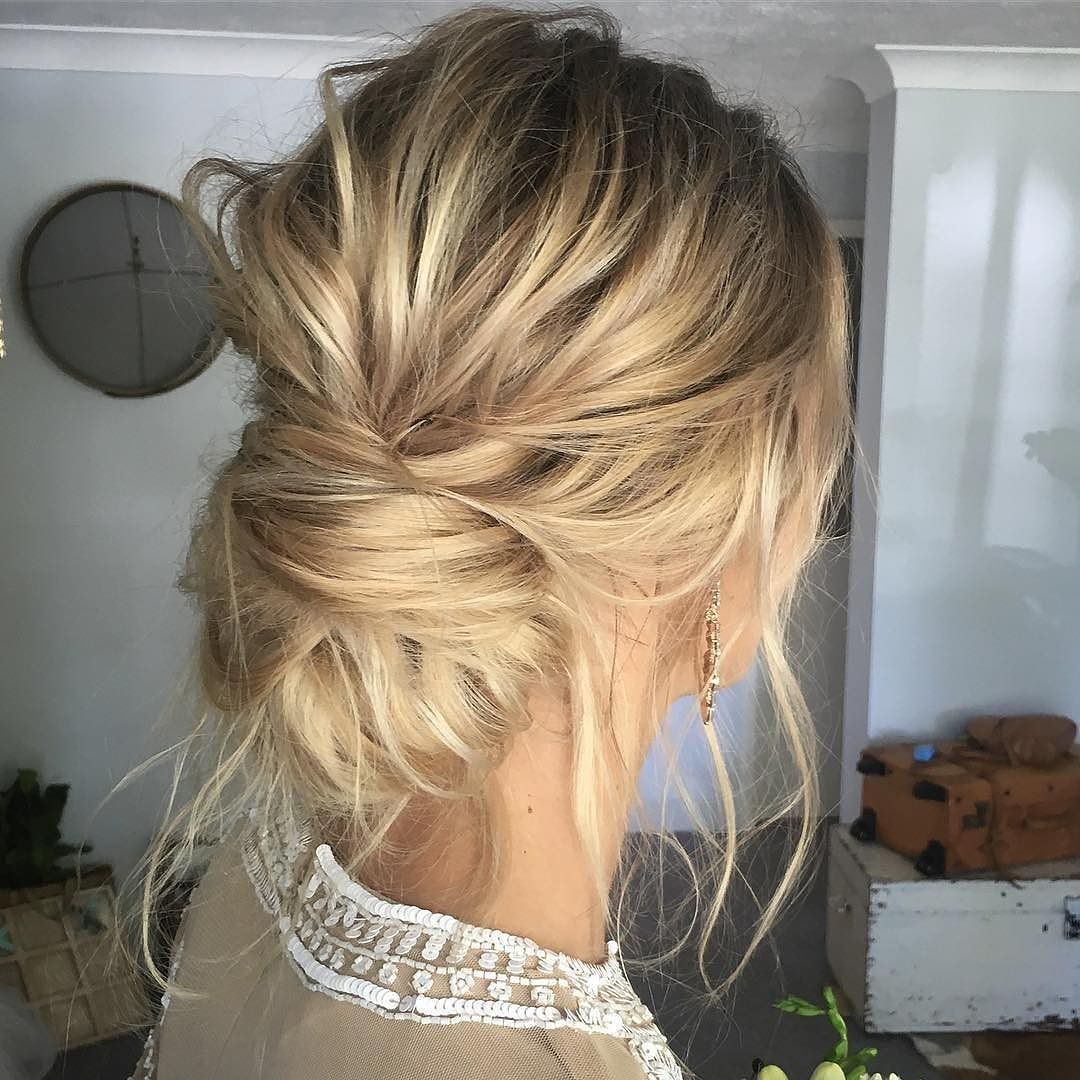 Platinum Blonde Messy Updo With Loose Tendrils Platinum Blonde Messy Updo With Loose Tendrils β Winter Formal Hairstyles